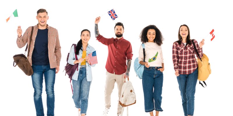 multiethnic group of people with backpacks and flags of different countries  isolated on white