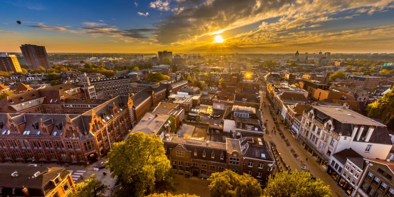 Aerial Skyline view of historic Groningen city centre under setting sun. The Netherlands